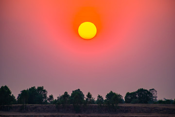 The sun sets on a large lake.29