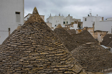 Fototapeta na wymiar ALBEROBELLO, APULIA, ITALY - FEBRUARY 03 - Beautiful view of the traditional trulli houses with their conical roof on february 03, 2019 
