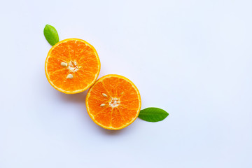 High vitamin C. Fresh orange citrus fruit with leaves isolated on white.