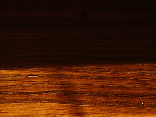 Empty wooden table background texture with shadows on surface, top view