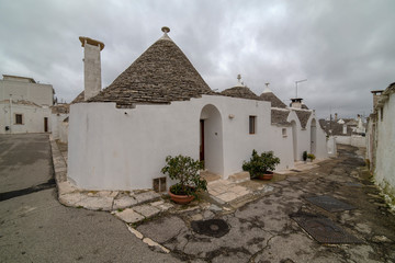 ALBEROBELLO, APULIA, ITALY - FEBRUARY 03 - Beautiful view of the traditional trulli houses with...