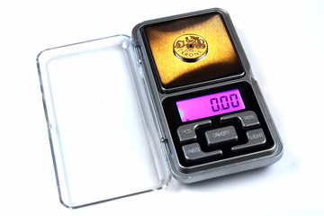 Norwegian crown coin on scales, shows zero weight. Currency inflation concept.