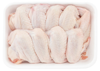 raw chicken wings in tray isolated on white background