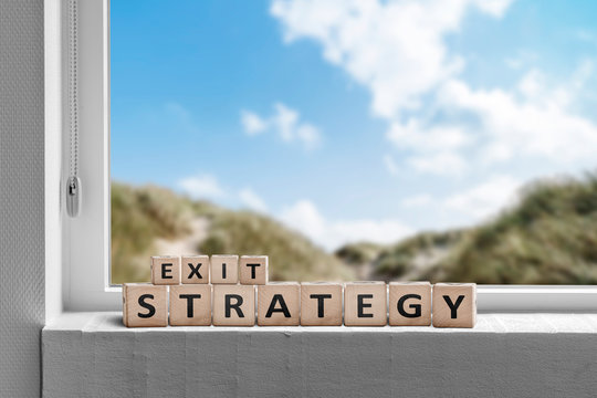 Exit strategy sign in a window with a view