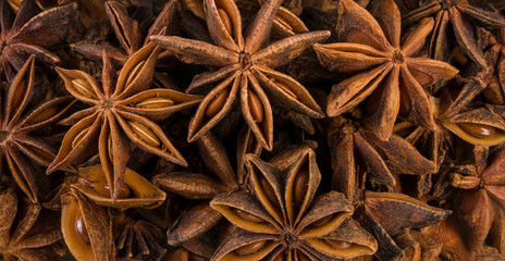anise stars background. Natural seasoning texture.
