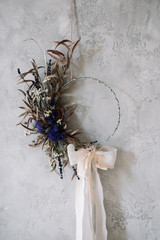 Beautiful hand made everlasting dry wreath made of dry flowers, eucalyptus tied with tender pastel...