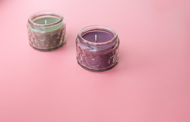 fragrant candles on a pink background