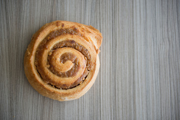 Bun on Wood Table.