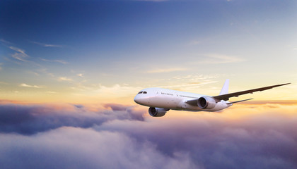 Passengers commercial airplane flying above clouds