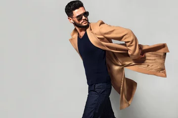 Elegant young handsome main coat wearing glasses. Studio fashion portrait. © ASjack