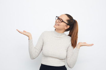 portrait of a young woman presenting your product copy space