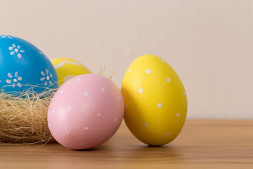 Easter eggs with colored eggs in nest