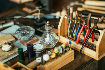 set of goldsmith's tool on the desk, close up photo