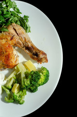 traditional fried chicken with vegetables sauce and greens