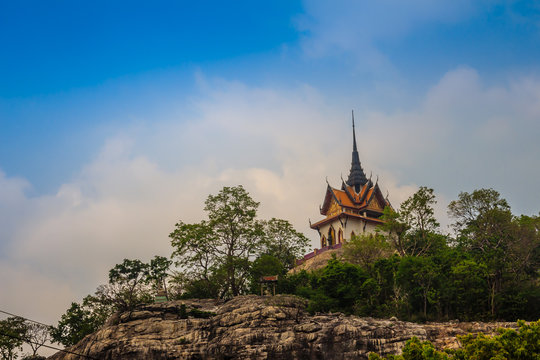 Beautiful white buddhist pavilion on the hilltop with blue sky background at Wat Phraputthachai temple, Saraburi, Thailand. This temple is public for entry and tourist can enjoy the 360-degree view. - Powered by Adobe
