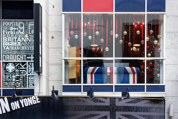 A union jack sofa in a pub window on Yonge Street in Toronto, Canada