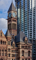 The Old City Hall in Toronto contrasts with the modern architecture that surrounds it - behind is the Bank of Montreal (BMO) Building