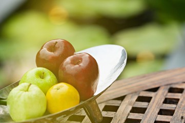 Thai exotic tropical fruits in luxury silver basket, welcome fruit basket in hotel