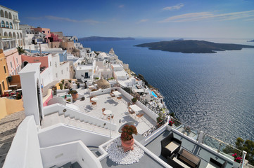 Afternoon view over town and ocean at Fira Thira Santorini Island Greece. - obrazy, fototapety, plakaty