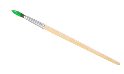 Brush with color paint on white background, top view