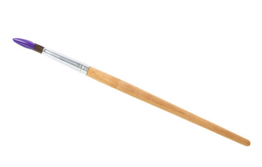 Brush with color paint on white background, top view