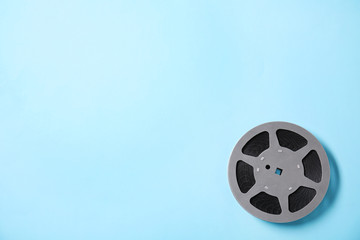 Obraz premium Movie reel on color background, top view with space for text. Cinema production