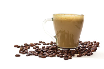 Transparent glass cup with coffee and coffee beans on white background. Bright tone, soft focus