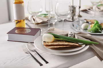Festive Passover table setting with Torah. Pesach celebration