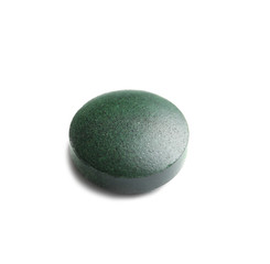 Spirulina tablet on white background. Healthy lifestyle