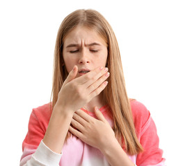 Teenage girl suffering from cough isolated on white