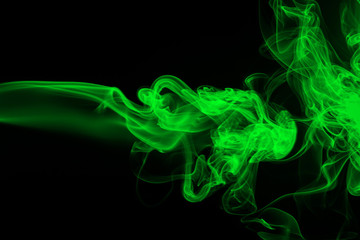 Green Smoke abstract on black background, darkness concept