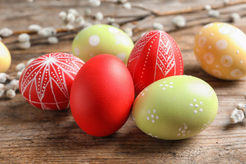 Colorful painted Easter eggs on wooden table