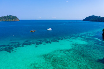 Aerial view of the beautiful coral reef and jungle around the remote Kyun Phi Lar (Greater Swinton) island in the Mergui Archipelago, Myanmar