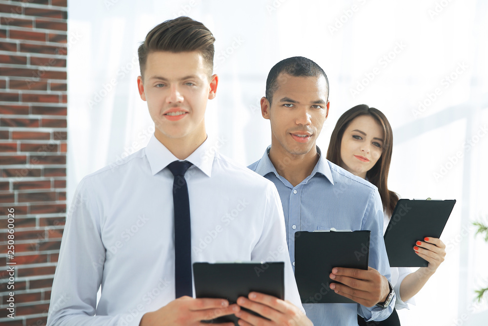 Wall mural portrait of an executive business team on office background