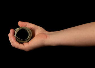 Fan of dollars in a male hand on a black background