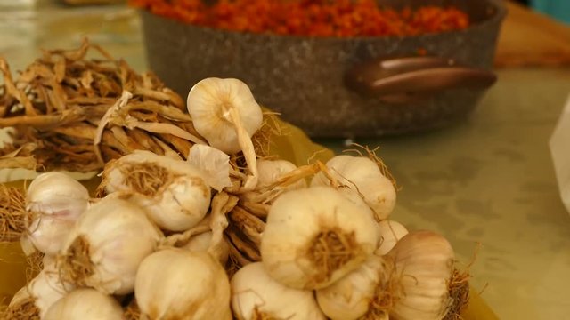A bunch of garlic, garlic along with plant roots,