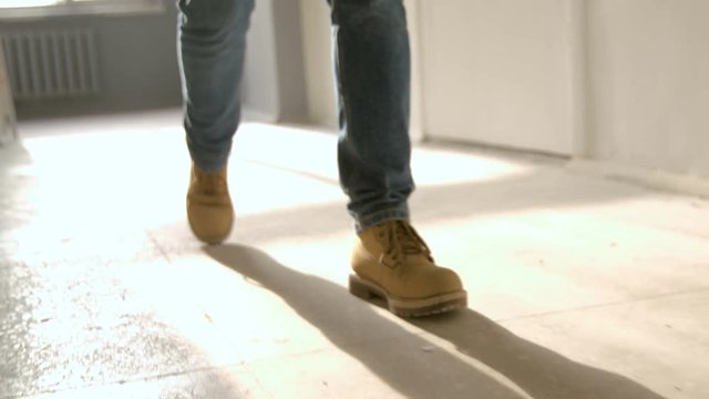 Heavy footsteps along the corridor. The old boots in slow motion