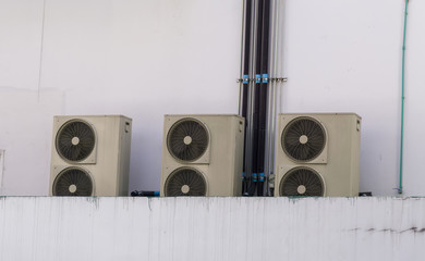 Old air conditioner on the side of the building.