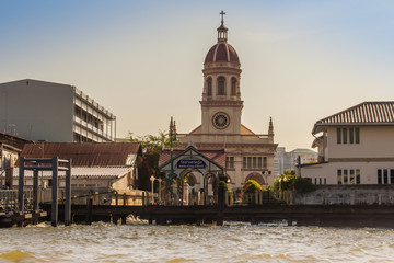 Beautiful crimson dome of Santa Cruz Church towers beside the Chao Phraya River. Santa Cruz Church also known as Kudi Chin, one of the many old Catholic churches in Bangkok, was built in 1770.