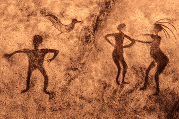 Image of ancient people on the wall of the cave. history of antiquities, archaeology.