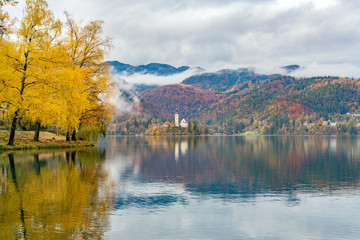 Beautiful autumn landscape around Lake Bled with Pilgrimage Church of the Assumption of Maria
