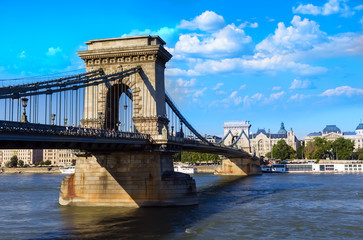 Obraz premium Chain bridge in summer day and clouds in the sky
