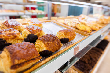 Closeup of fresh bakery products in the shop. Wheat, bake, food.