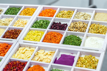 Dried vegetables in wooden box, onions, beets, carrots, pumpkin, bay leaf. Superfoods, herbs.