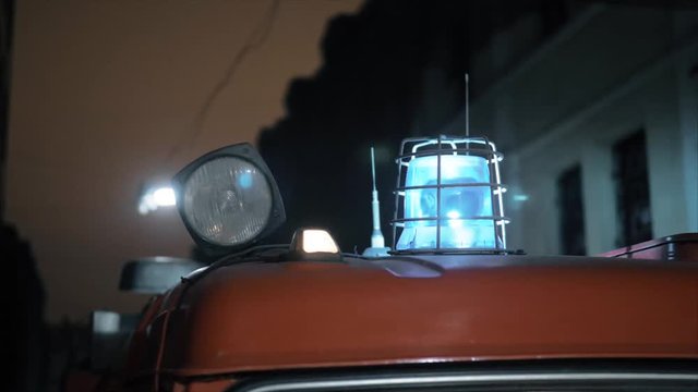 Red and blue blinking lights on top of the firetruck
