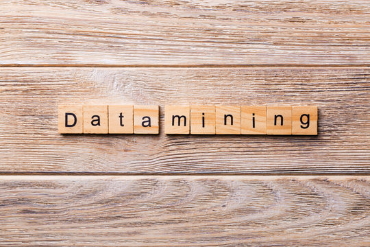Data mining word written on wood block. Data mining text on wooden table for your desing, concept