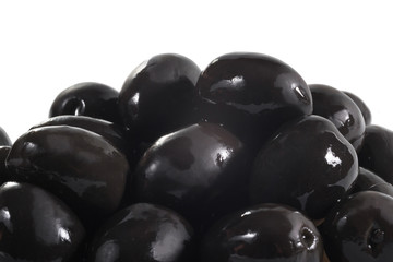 Group of black olives on the white isolated background, close up