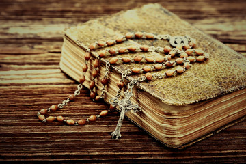 Old prayer book and rosary, close up vintage view