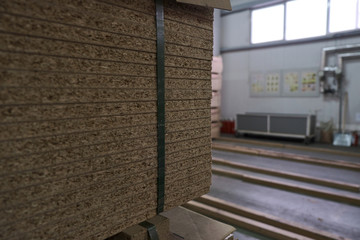 Laying chipboard for processing and production of furniture in a woodworking enterprise.