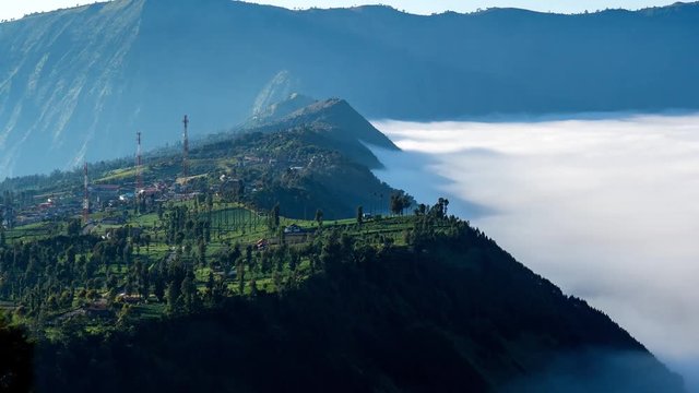 4K Cinematic Zooming Out Timelapse Footage of The Dancing Carpet Clouds of Bromo Tengger Semeru National Park at Cemoro Lawang vilage, Ngadisari, East Java, Indonesia.